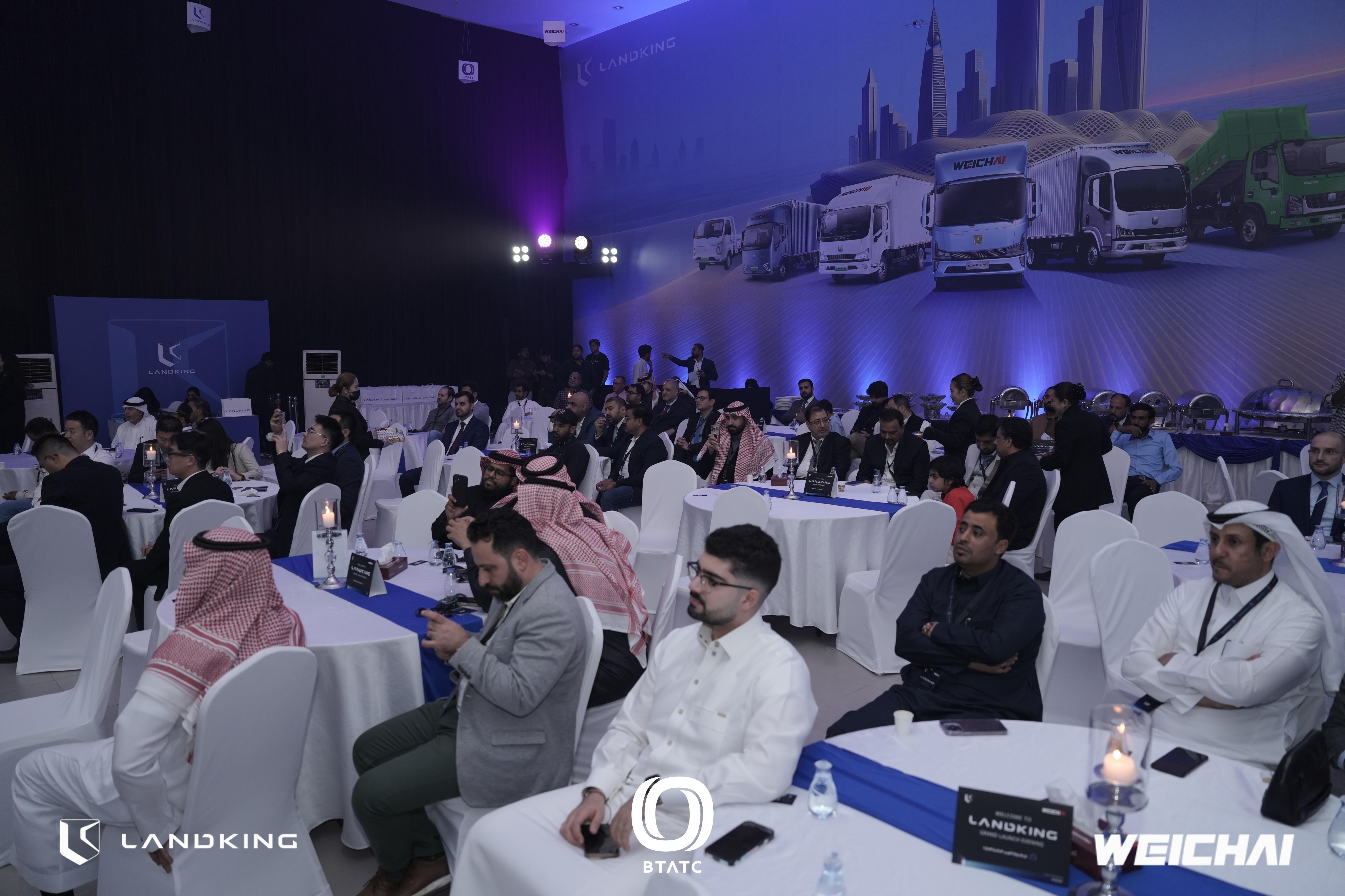 Guests posting Snapshare photos from LANDKING H-Series launch on social media, creating organic digital reach and brand visibility.